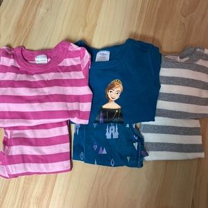 Three pairs of girls Hanna Andersson Pajamas.